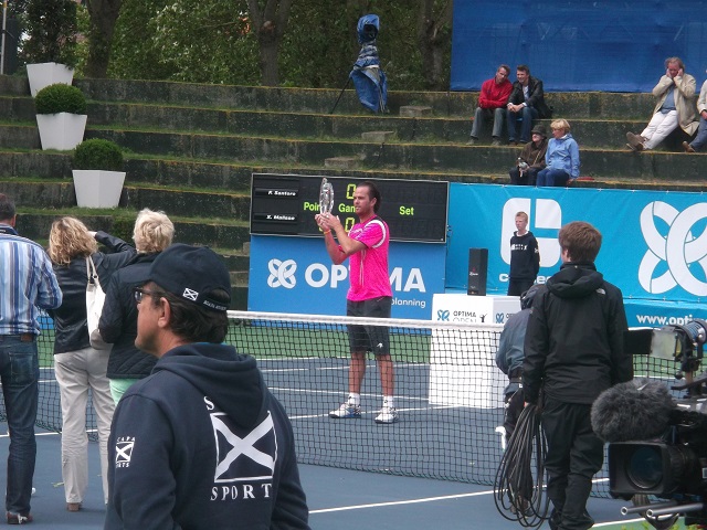 Malisse accepts his trophy 